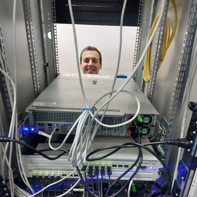 Colleague working among server racks